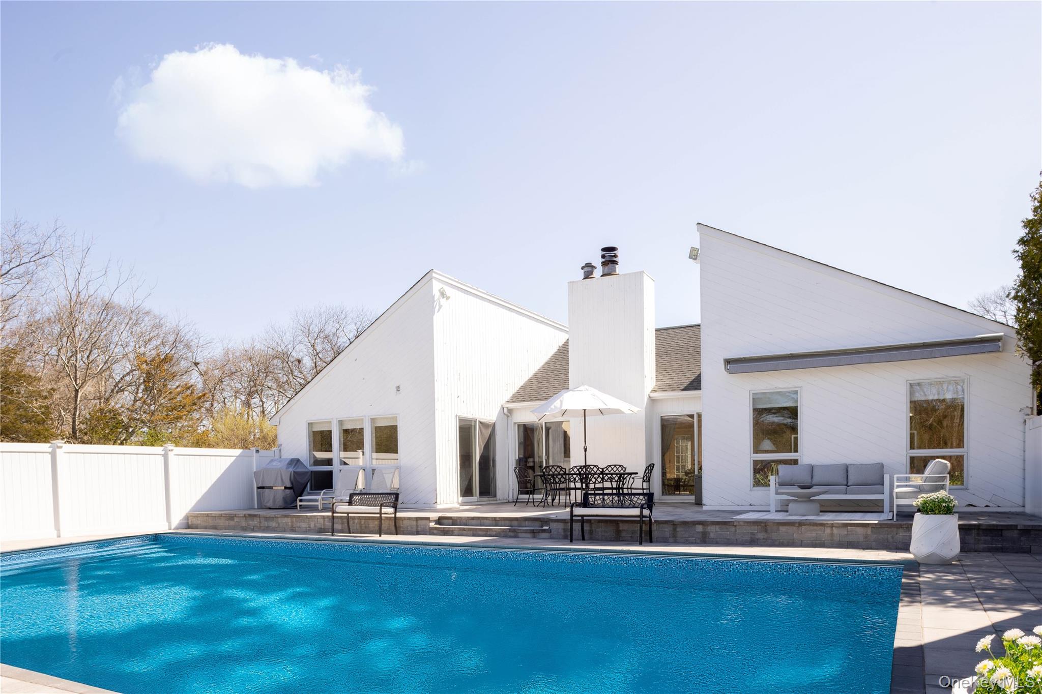 a view of a house with outdoor kitchen