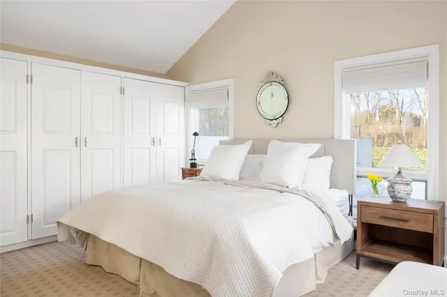 a bedroom with bed and a window