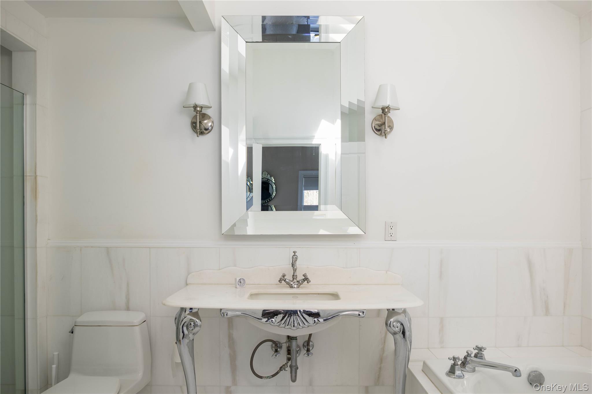 3 Clay Pit Road Remsenburg, NY 11960 - Photo 13 of 20 a bathroom with a sink toilet and mirror
