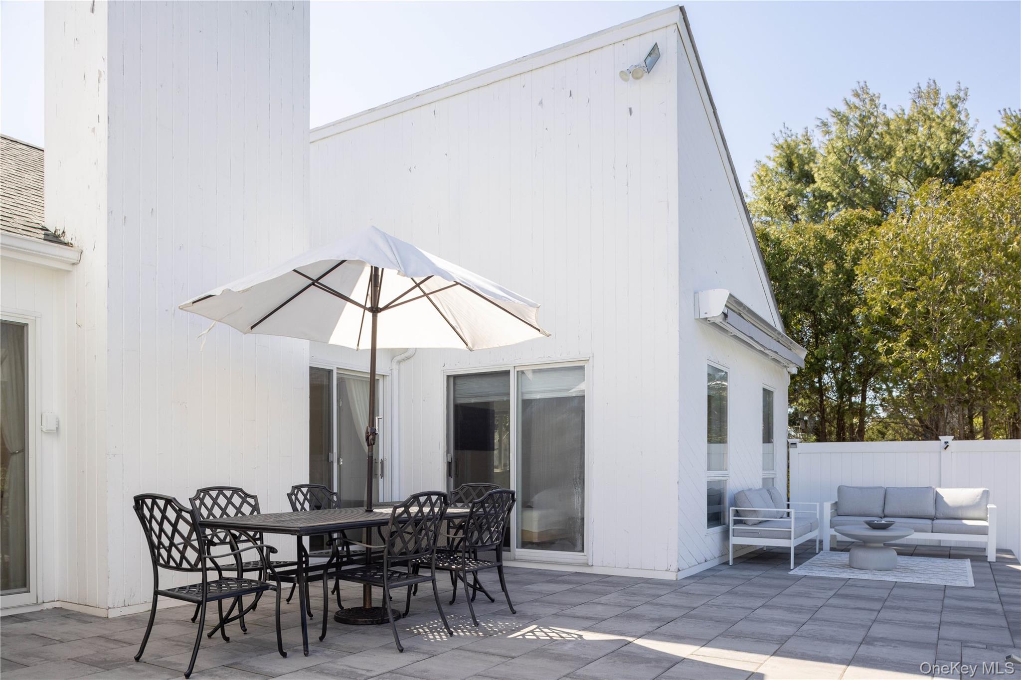 3 Clay Pit Road Remsenburg, NY 11960 - Photo 16 of 20 a view of a patio with a table and chairs