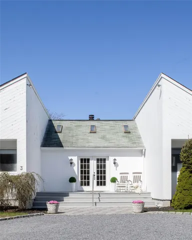 a front view of a house with a garage