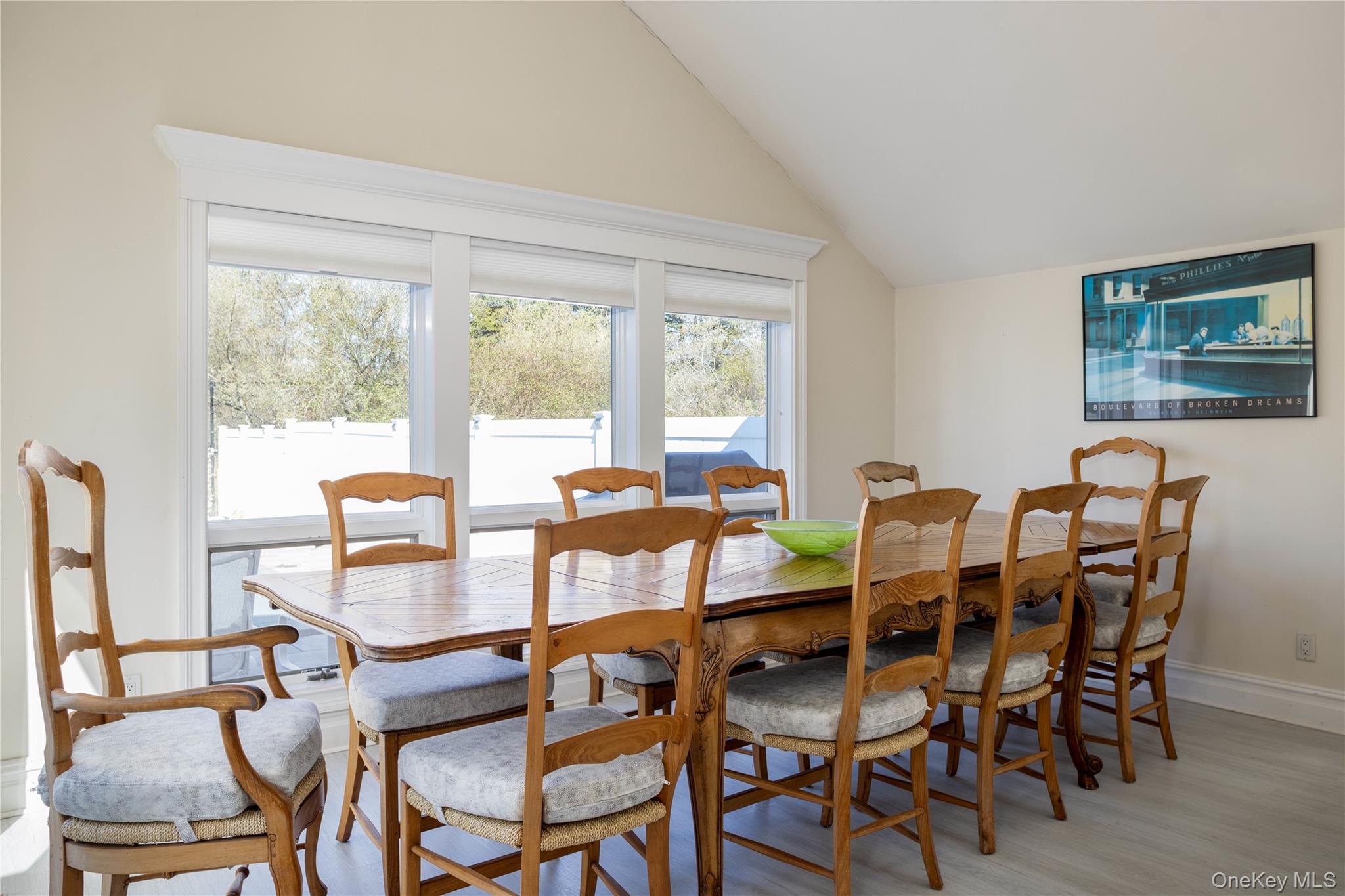 3 Clay Pit Road Remsenburg, NY 11960 - Photo 7 of 20 a view of a dining room with furniture large windows and wooden floor