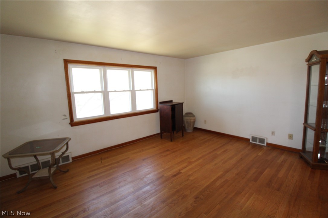 18800 Neff Road Cleveland, OH 44119 - Photo 30 of 38 Spare room with wood-type flooring