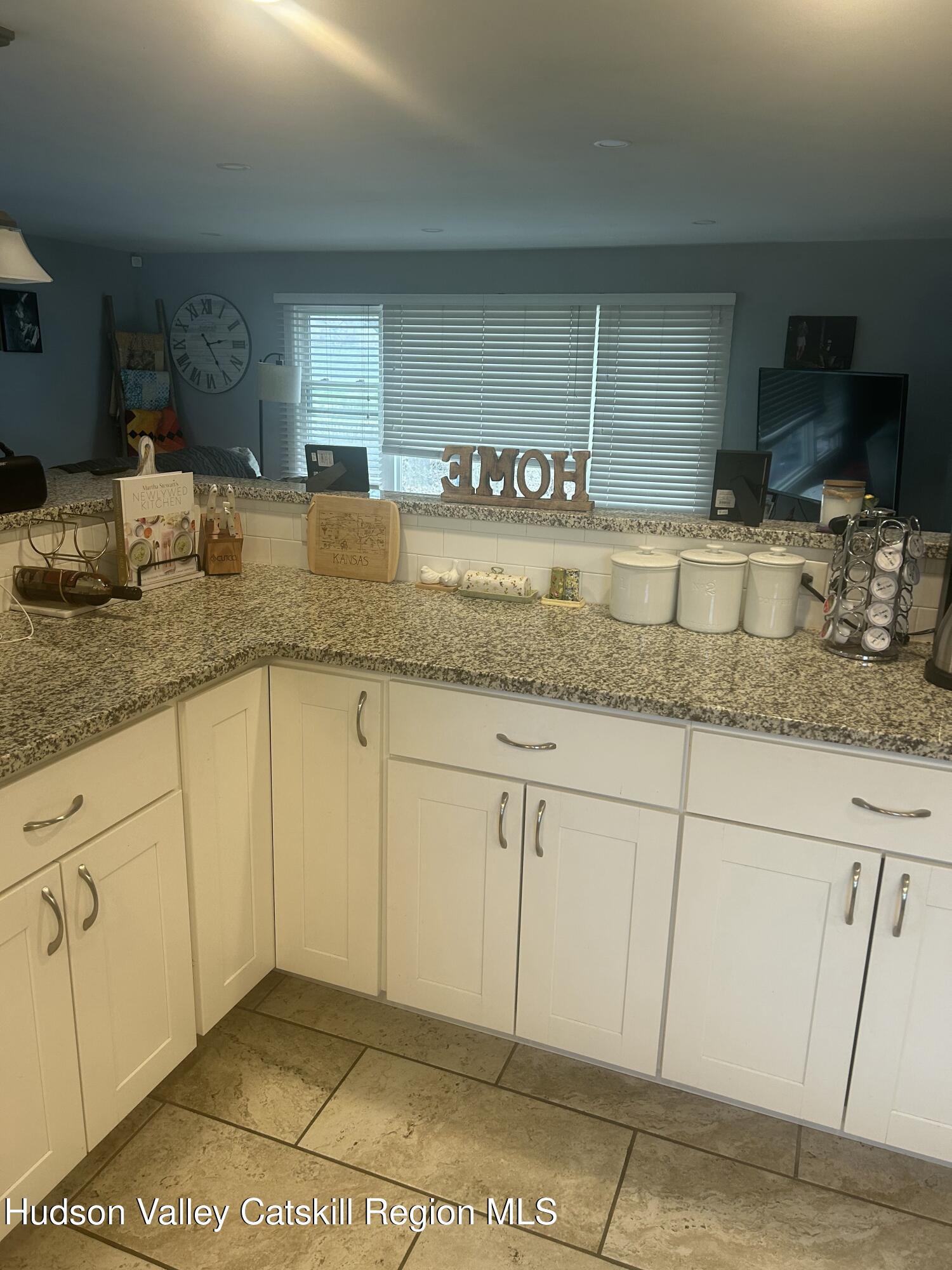 22 Caywood Road Poughkeepsie, NY 12603 - Photo 7 of 27 a kitchen with stainless steel appliances granite countertop a sink and cabinets