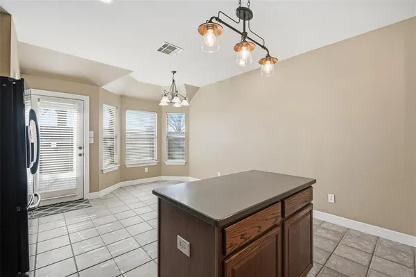a bathroom with a sink a large mirror and shower