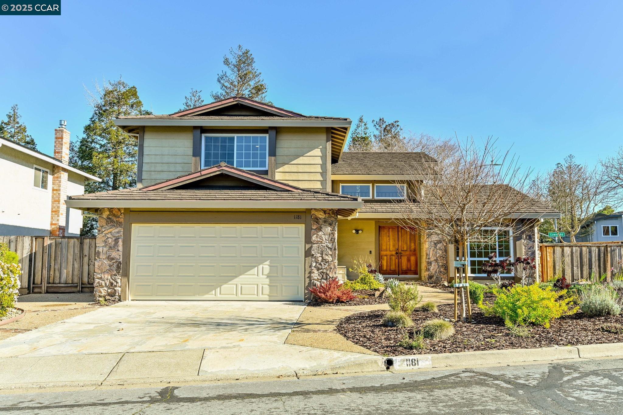 a front view of a house with garden