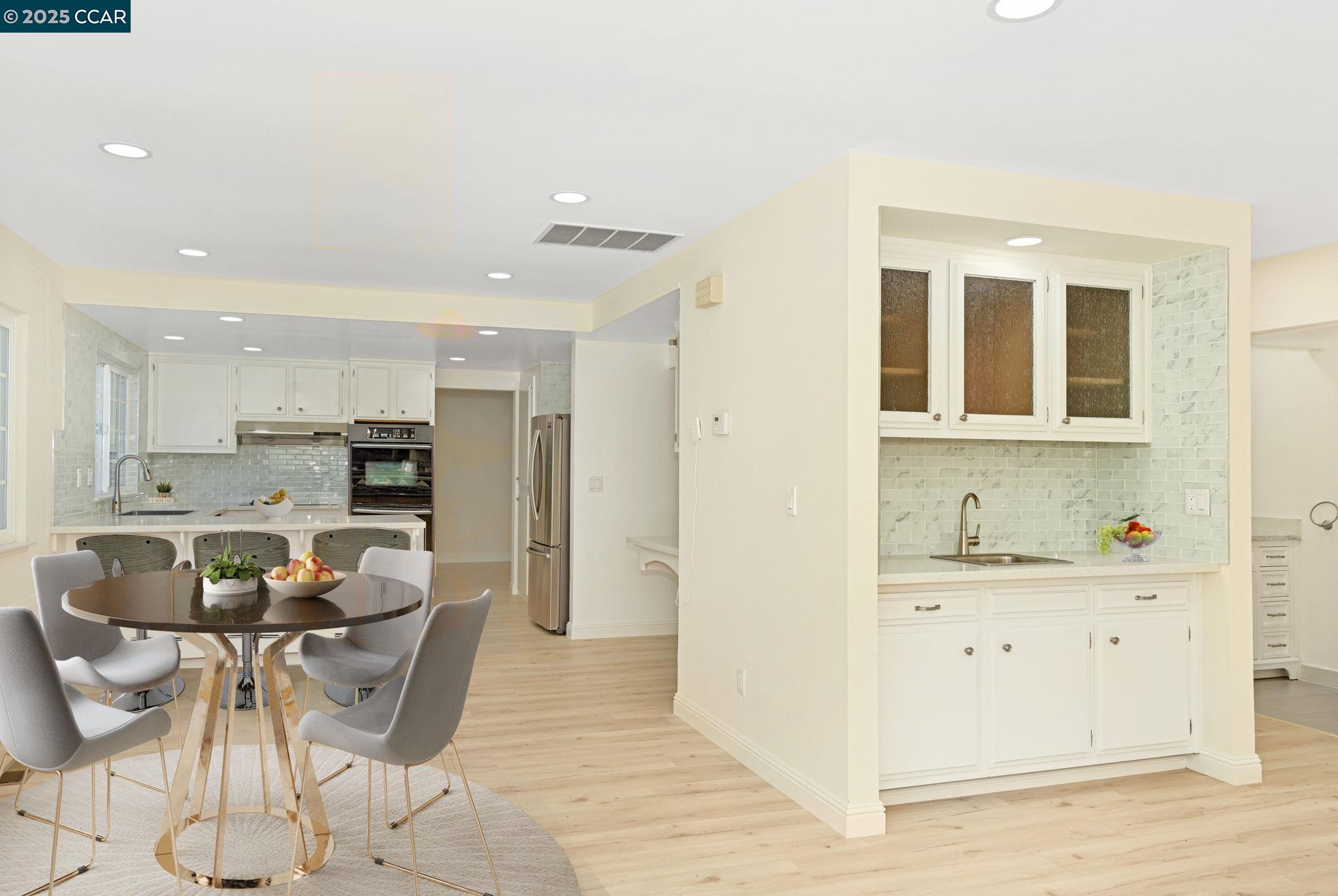 1181 Sunlight Circle Concord, CA 94518 - Photo 14 of 36 a living room with stainless steel appliances kitchen island granite countertop furniture and a kitchen view