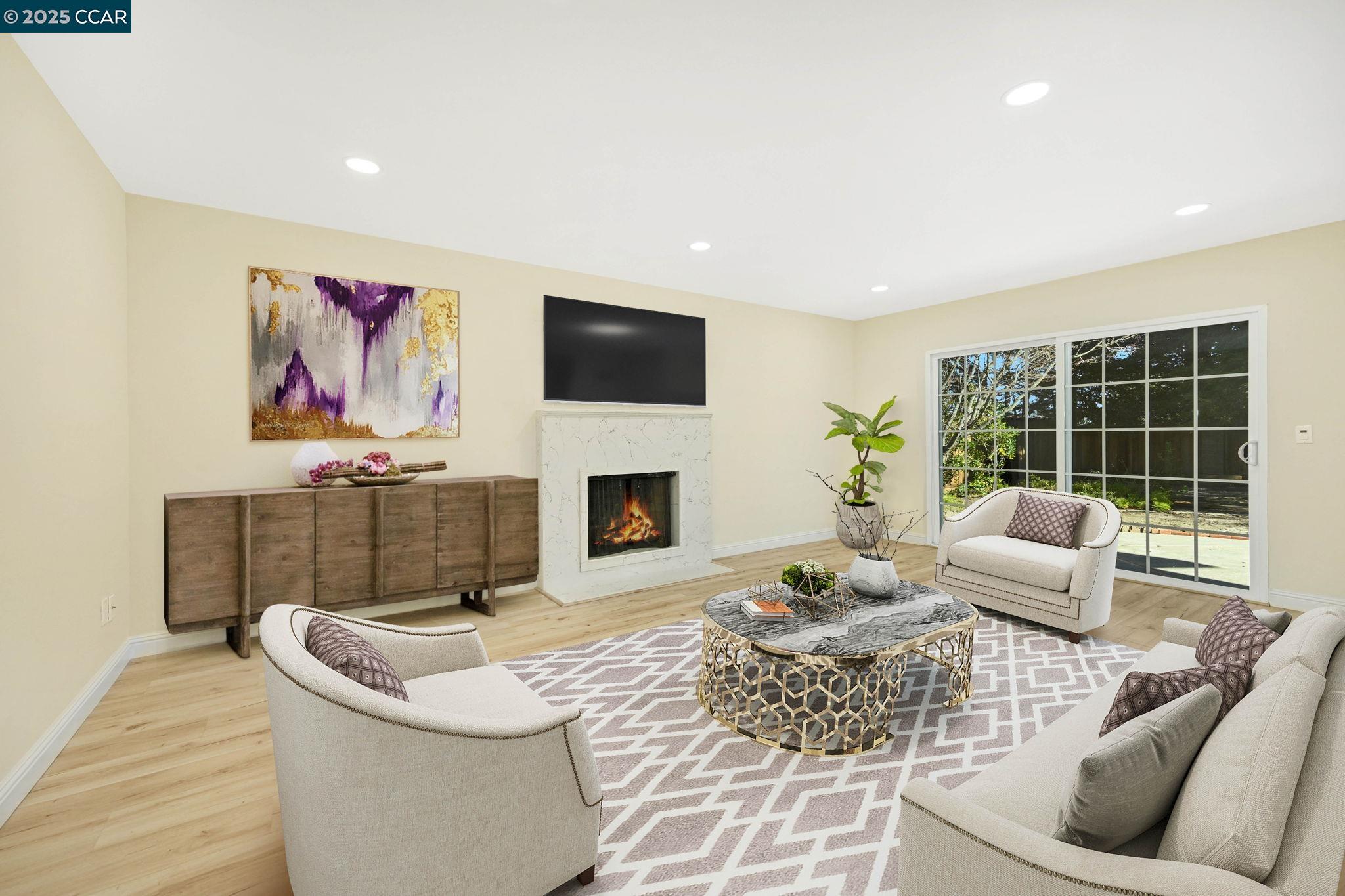 1181 Sunlight Circle Concord, CA 94518 - Photo 16 of 36 a living room with furniture a fireplace and a flat screen tv