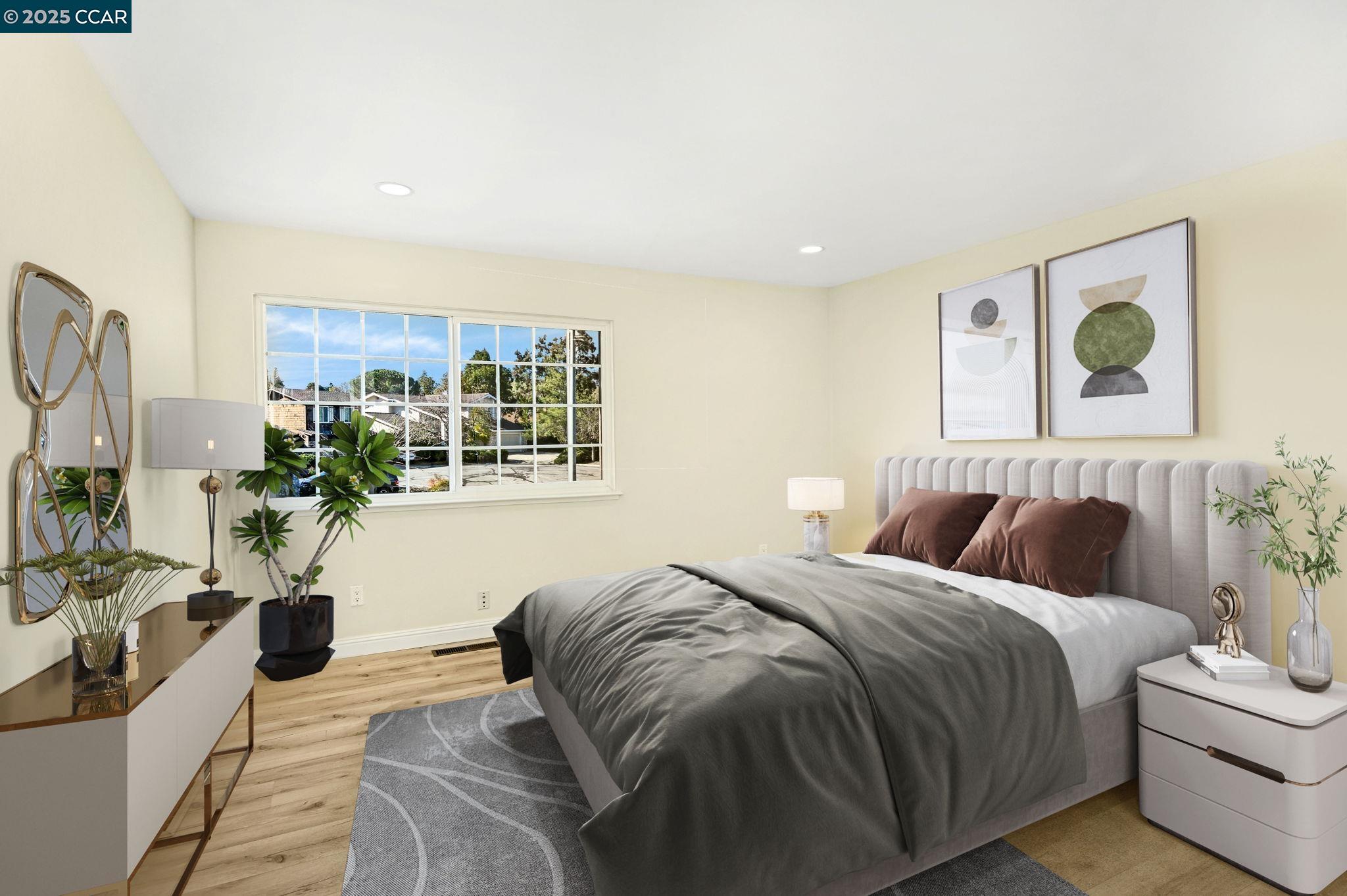 1181 Sunlight Circle Concord, CA 94518 - Photo 23 of 36 a bedroom with a large bed couch and potted plant on the dresser