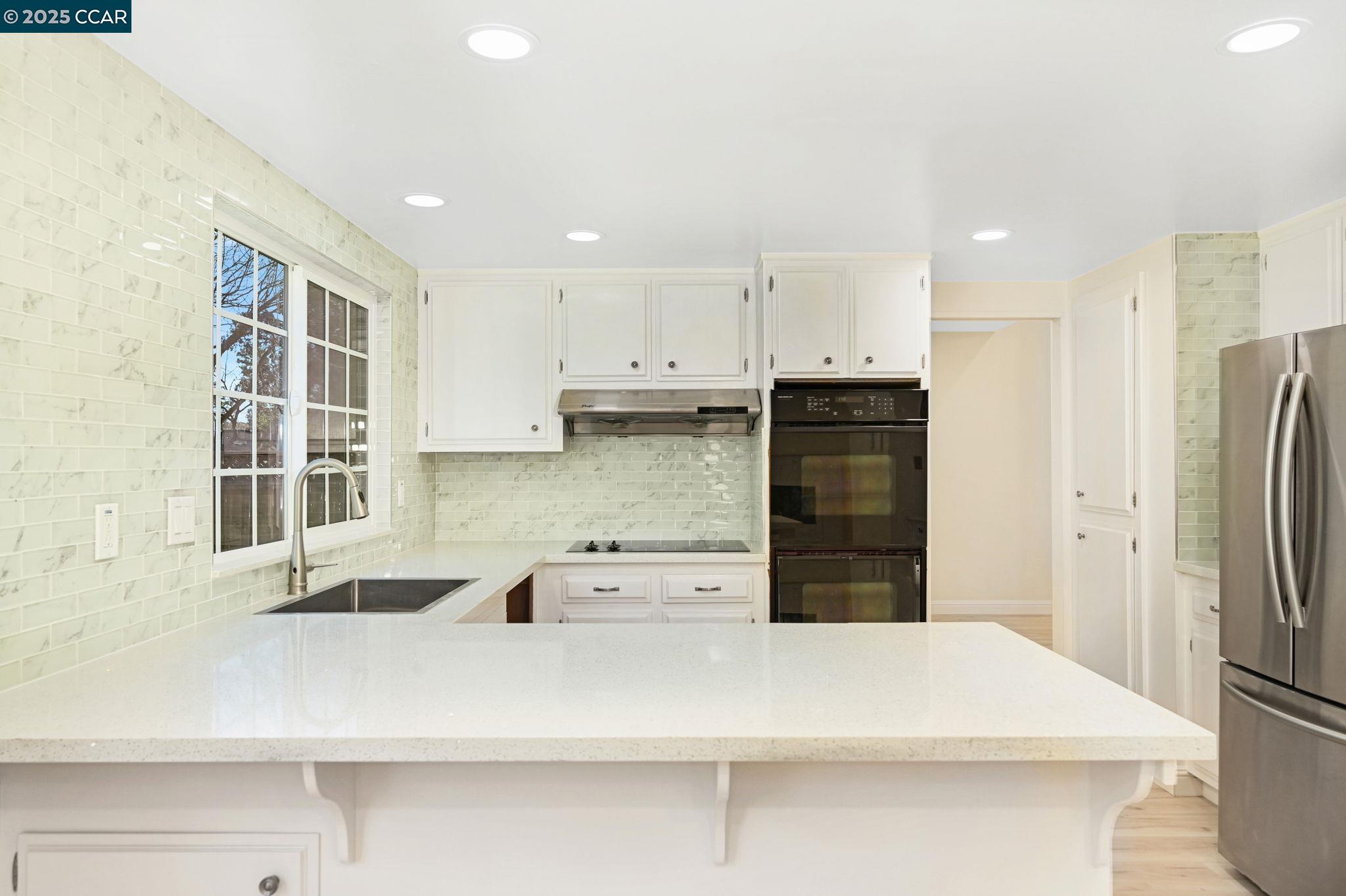 1181 Sunlight Circle Concord, CA 94518 - Photo 10 of 36 a kitchen with stainless steel appliances a refrigerator sink and cabinets