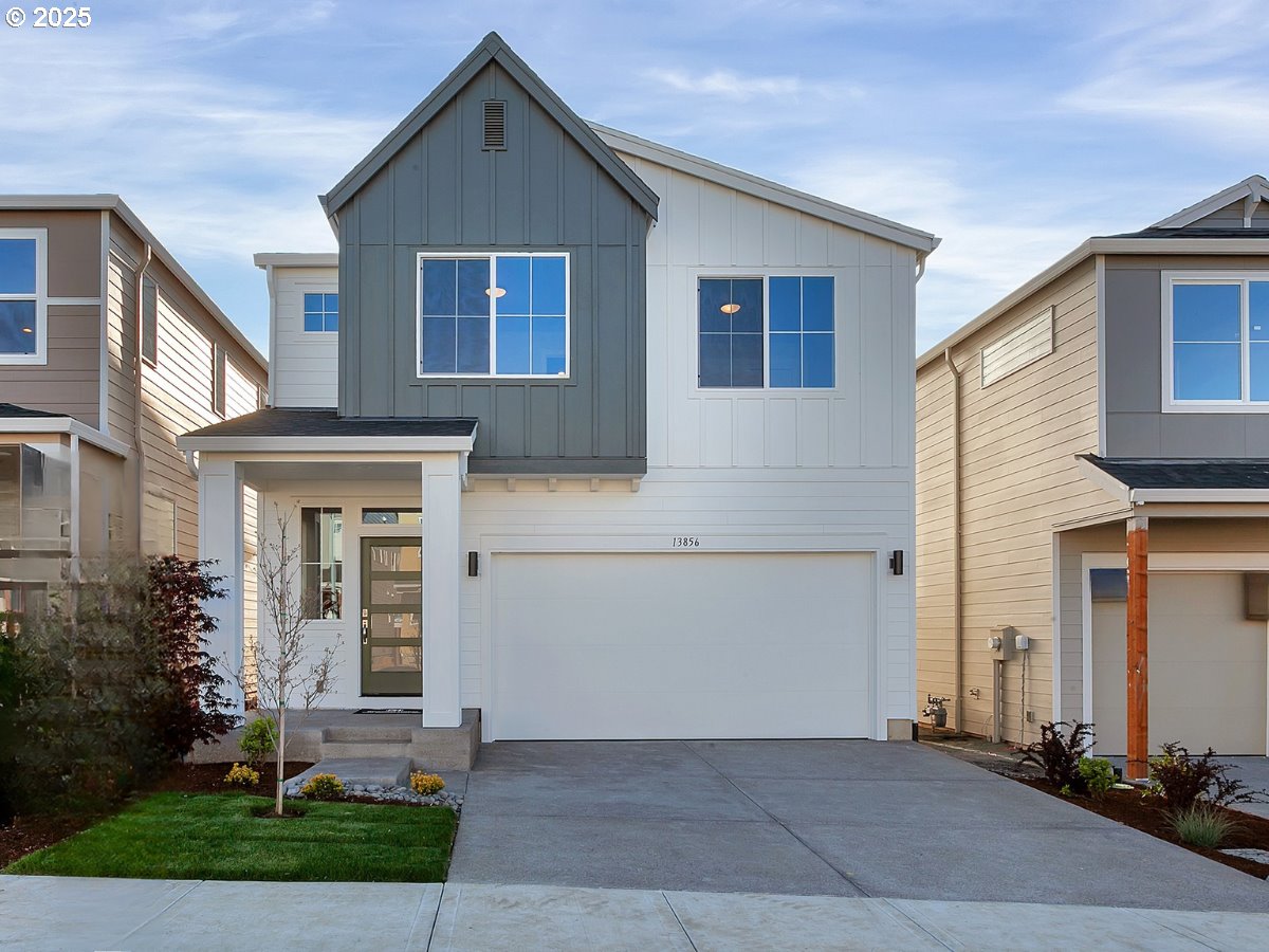 13858 Southwest 174th Avenue Tigard, OR 97140 - Photo 1 of 44 a front view of a house with garden