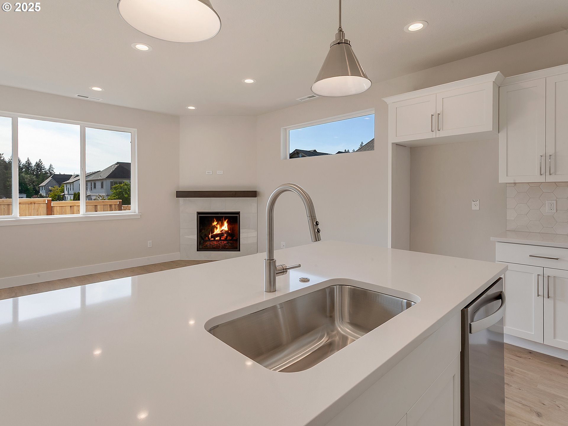 13858 Southwest 174th Avenue Tigard, OR 97140 - Photo 11 of 44 a kitchen with a sink and a refrigerator