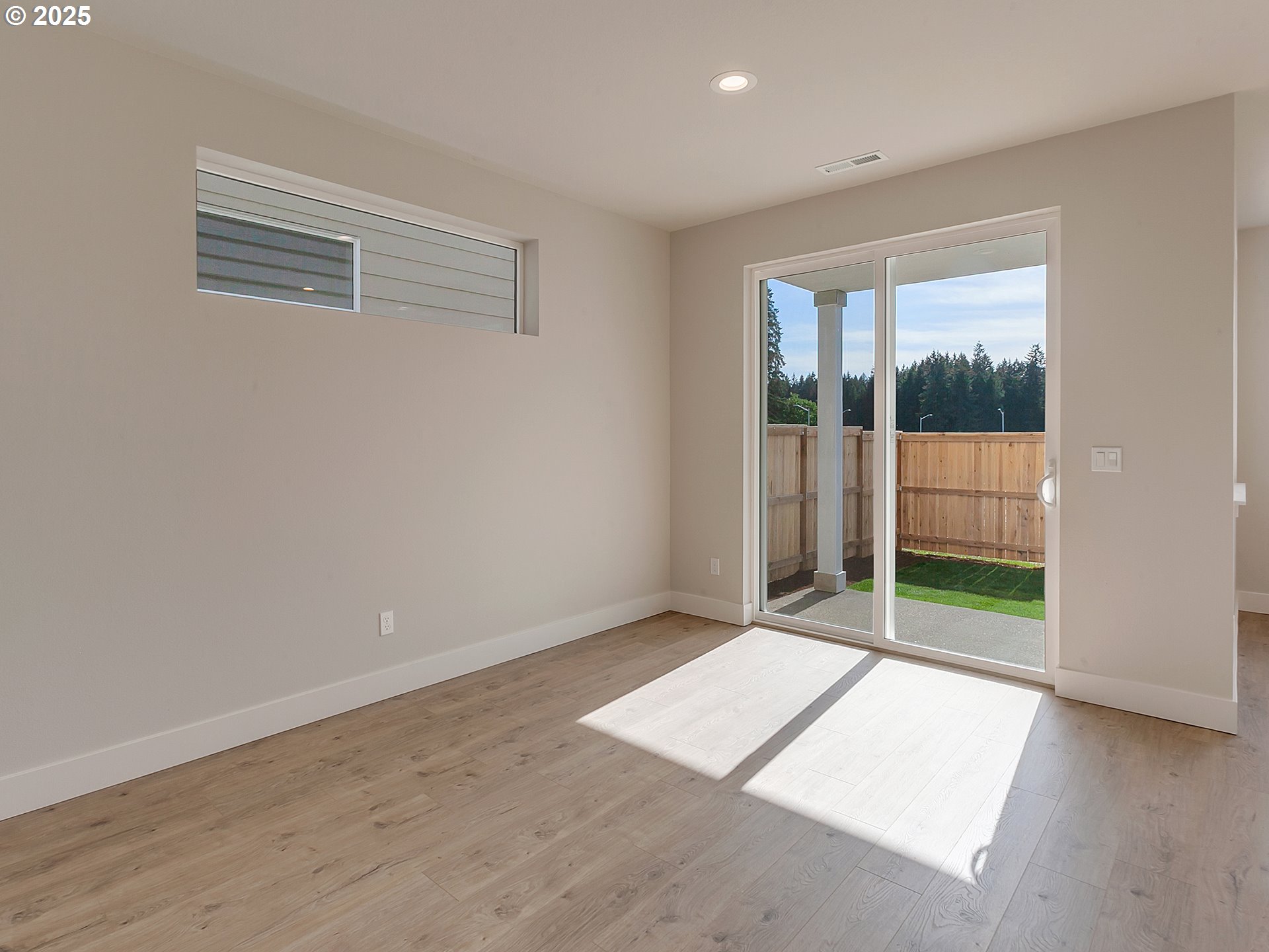 13858 Southwest 174th Avenue Tigard, OR 97140 - Photo 15 of 44 an empty room with sliding door and windows