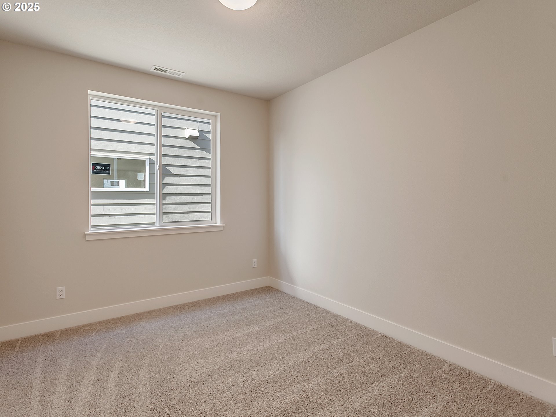 13858 Southwest 174th Avenue Tigard, OR 97140 - Photo 16 of 44 a view of an empty room with a window
