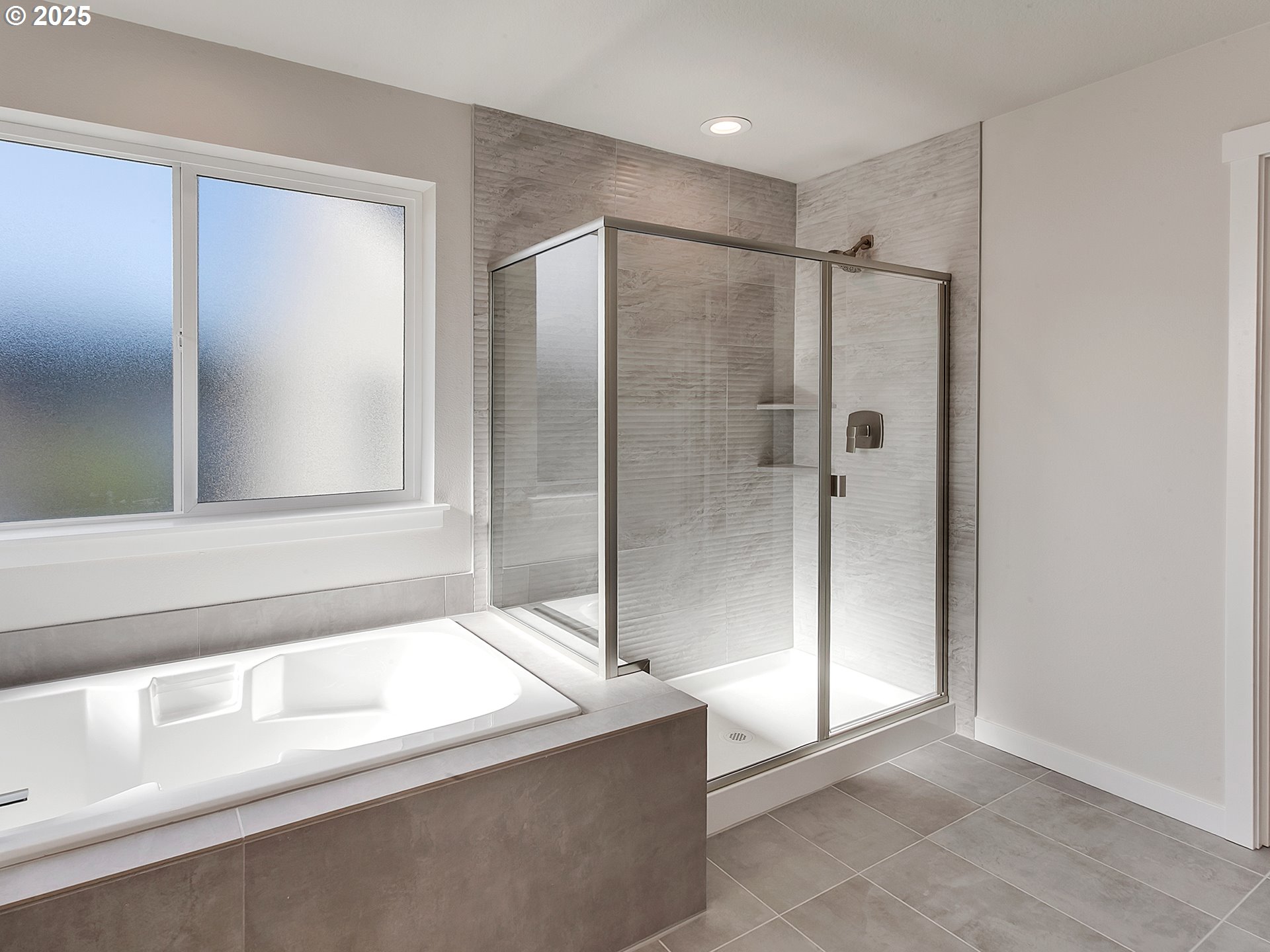 13858 Southwest 174th Avenue Tigard, OR 97140 - Photo 25 of 44 a bathroom with a bathtub and a shower
