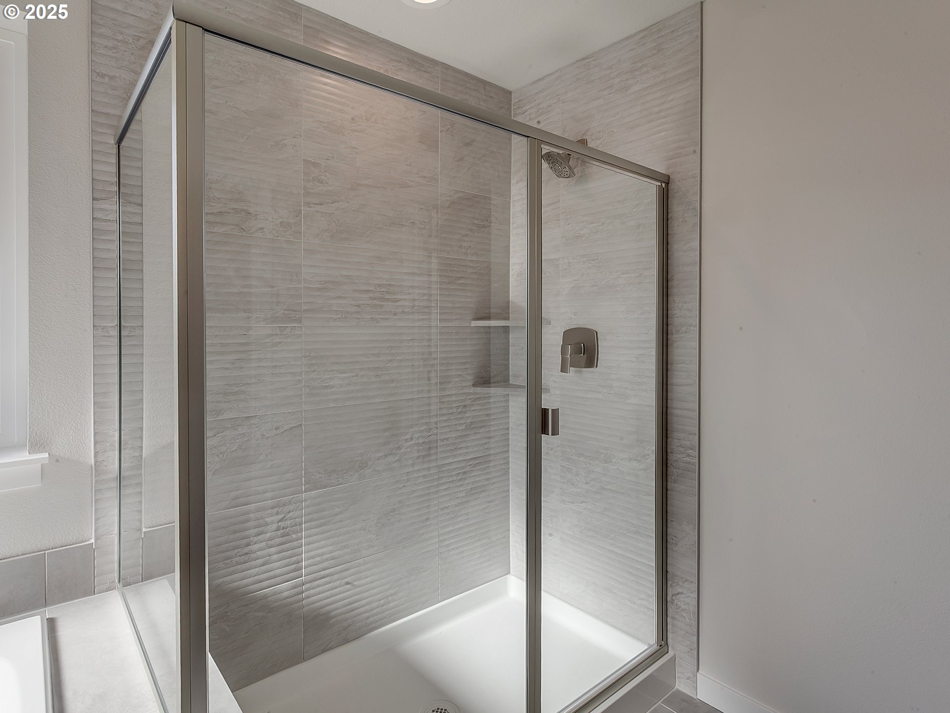 13858 Southwest 174th Avenue Tigard, OR 97140 - Photo 27 of 44 a bathroom with a glass shower door