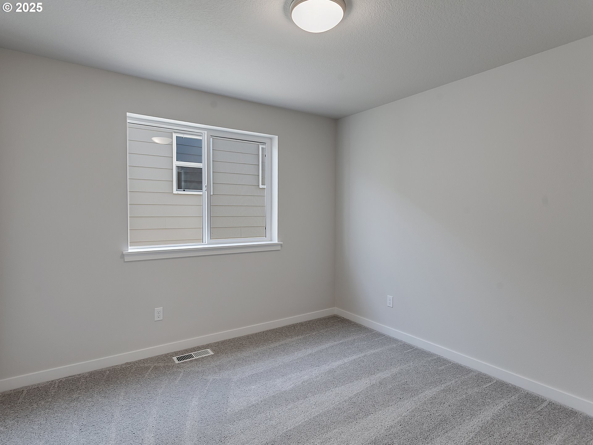 13858 Southwest 174th Avenue Tigard, OR 97140 - Photo 30 of 44 an empty room with a window