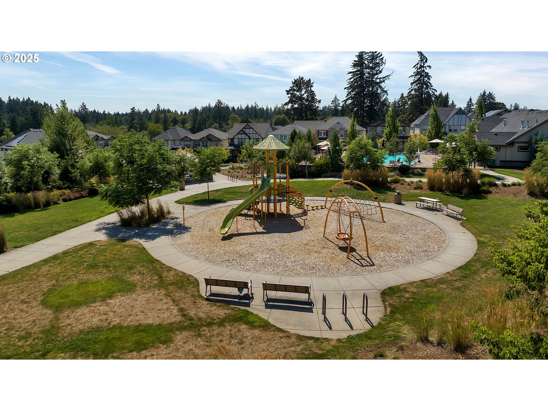 13858 Southwest 174th Avenue Tigard, OR 97140 - Photo 43 of 44 a backyard of a house with table and chairs