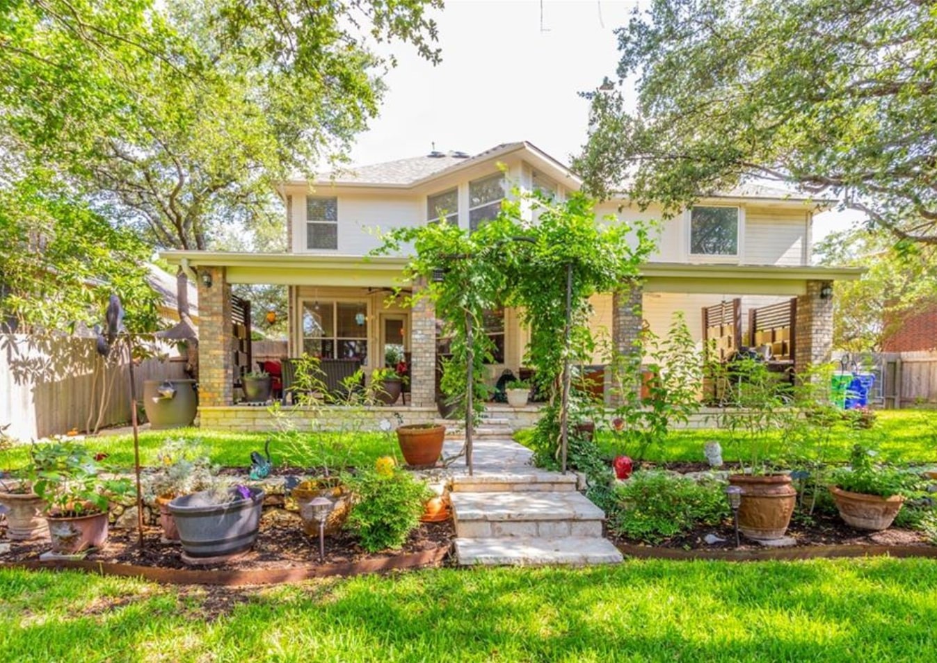 1100 Antelope Ridge Cedar Park, TX 78613 - Photo 23 of 24 a view of a house with a garden and plants