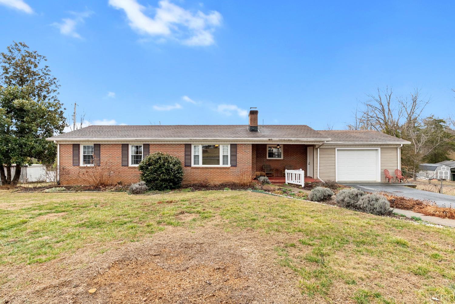3189 Wildway Road Appomattox, VA 24522 - Photo 18 of 44 a front view of a house with a garden