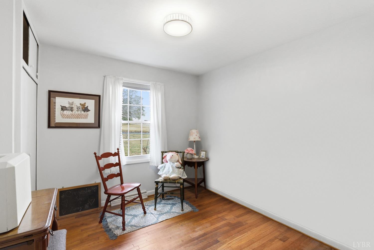 3189 Wildway Road Appomattox, VA 24522 - Photo 20 of 44 a workspace room with furniture and wooden floor