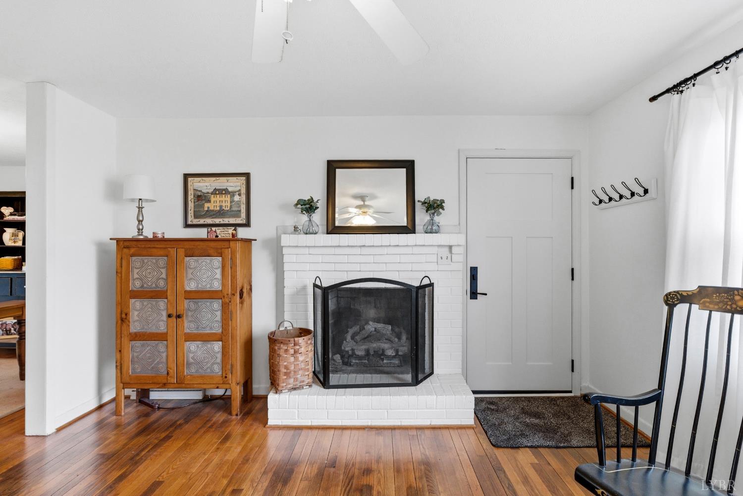 3189 Wildway Road Appomattox, VA 24522 - Photo 2 of 44 a living room with furniture and a fireplace