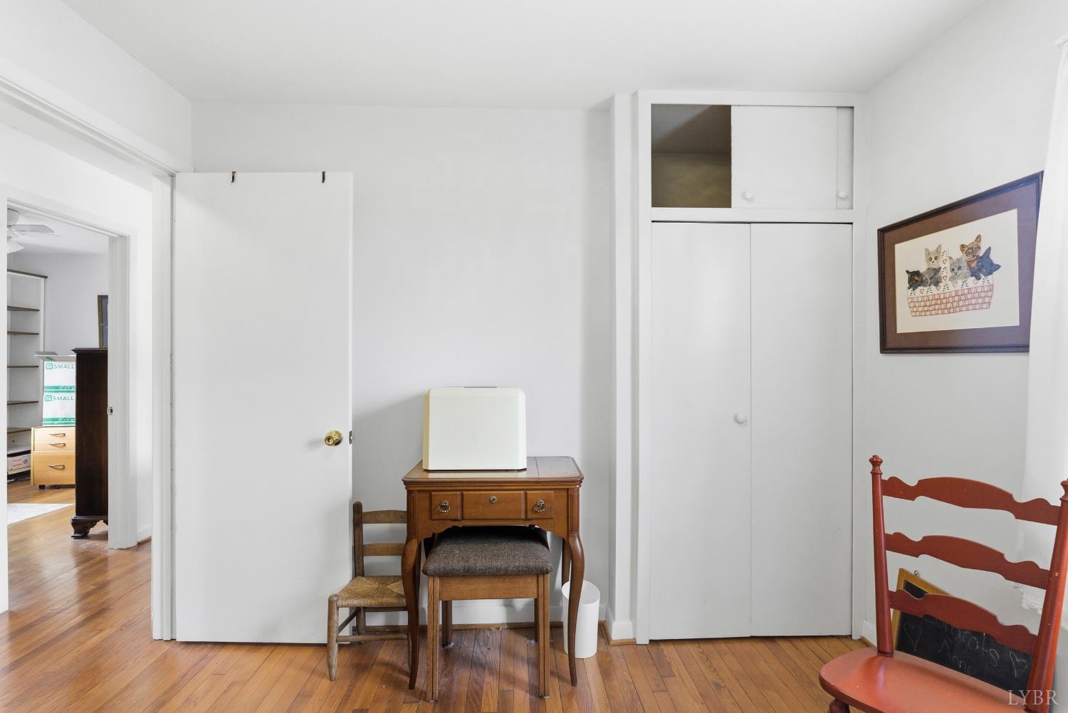 3189 Wildway Road Appomattox, VA 24522 - Photo 21 of 44 a view of a hallway with wooden floor and furniture