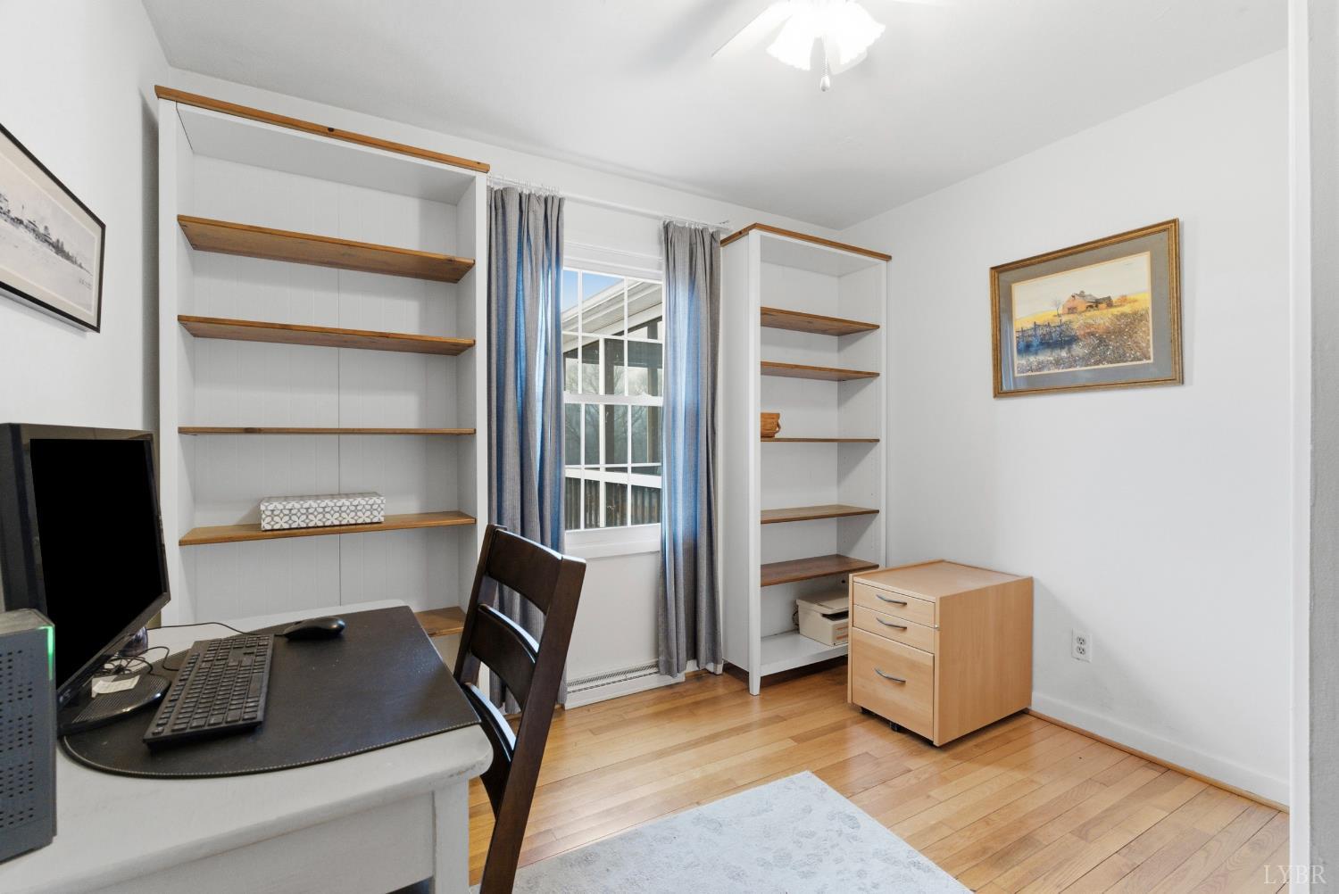 3189 Wildway Road Appomattox, VA 24522 - Photo 22 of 44 a view of a workspace with furniture and a window