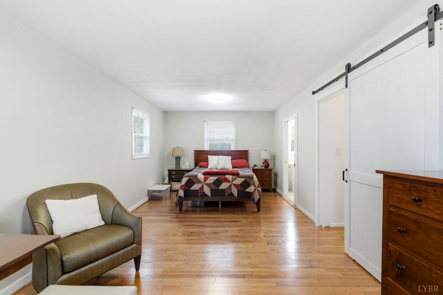 3189 Wildway Road Appomattox, VA 24522 - Photo 25 of 44 a bed room with furniture and wooden floor