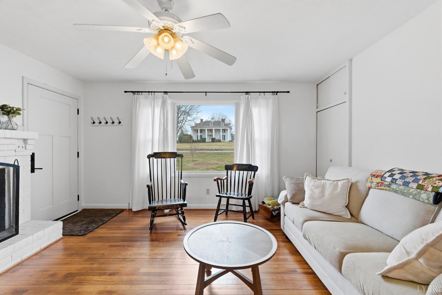 3189 Wildway Road Appomattox, VA 24522 - Photo 4 of 44 a living room with furniture and a chandelier