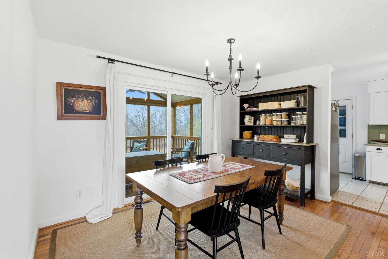 3189 Wildway Road Appomattox, VA 24522 - Photo 6 of 44 a view of a dining room with furniture window and wooden floor