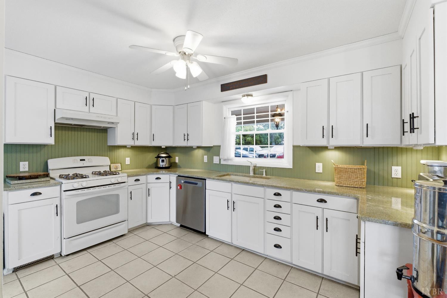 3189 Wildway Road Appomattox, VA 24522 - Photo 9 of 44 a kitchen with white cabinets and white appliances
