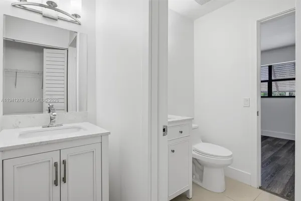 a bathroom with a shower and a sink