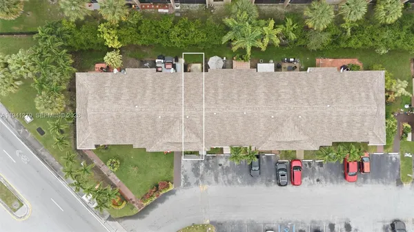 an aerial view of a house with outdoor space