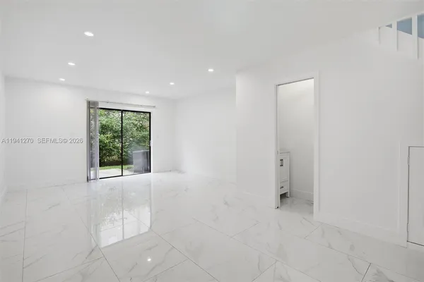 a view of an empty room with a window