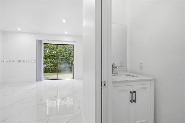 a view of room with window and hardwood floor