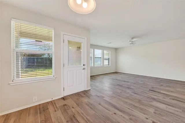 a view of a kitchen with a sink and a stove top oven