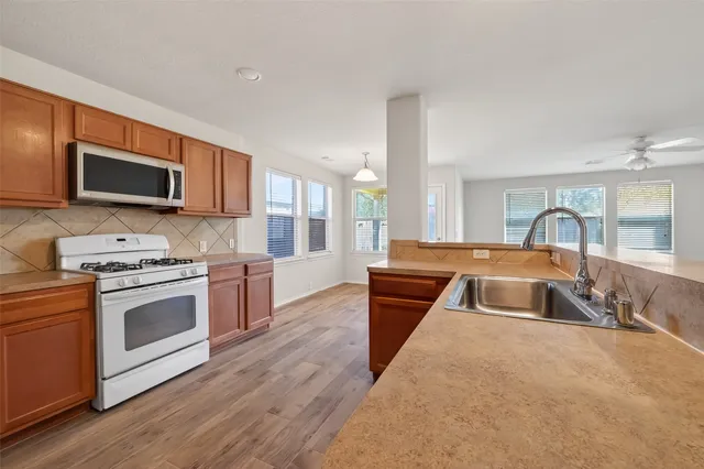 a view of a livingroom with wooden floor