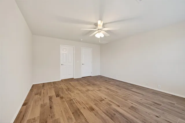 a bathroom with a shower and toilet