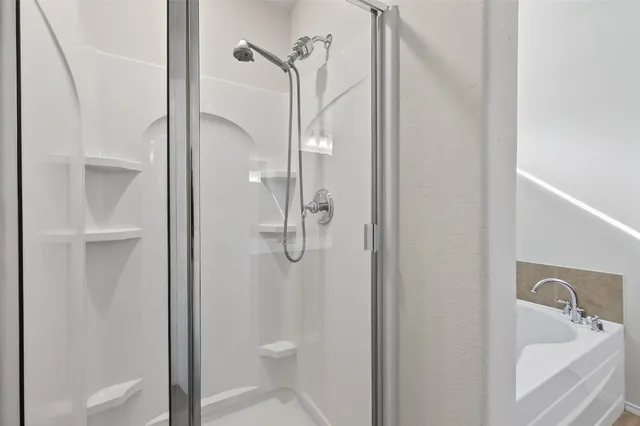 a bathroom with a sink double vanity and a mirror