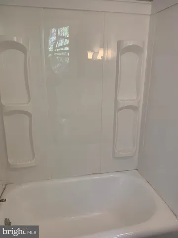 a bathroom with a sink toilet and a mirror