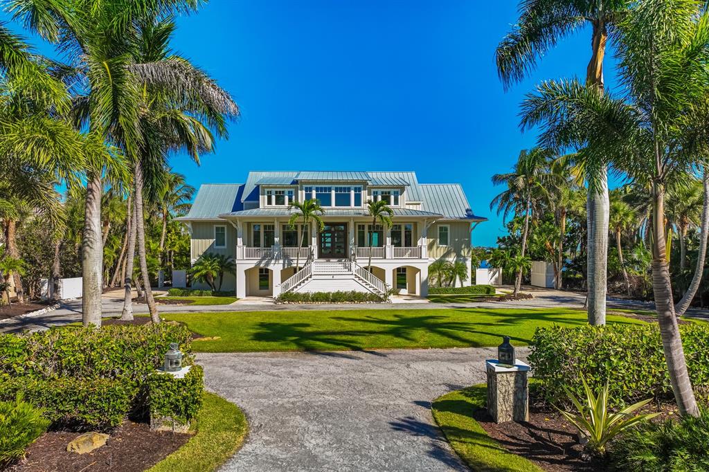 a front view of a house with a yard table and chairs