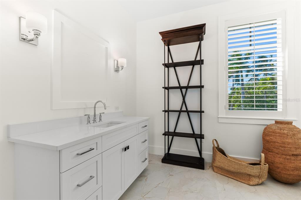 4070 Loomis Avenue Boca Grande, FL 33921 - Photo 26 of 59 a room with a window and a table