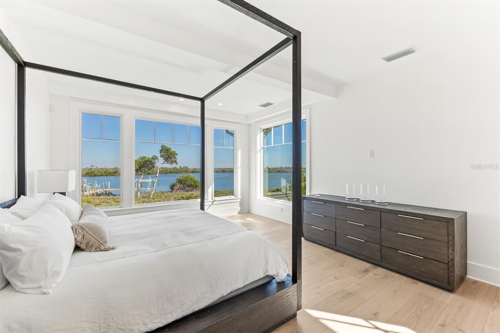 4070 Loomis Avenue Boca Grande, FL 33921 - Photo 27 of 59 a bedroom with a bed window and a mirror