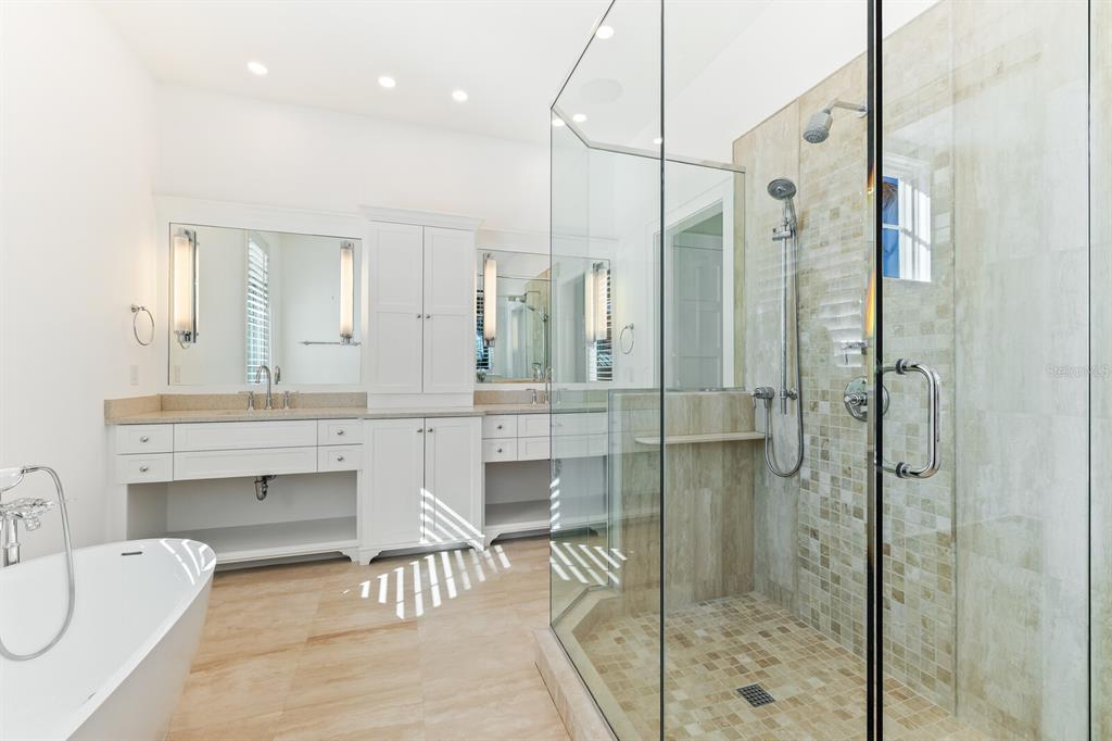 4070 Loomis Avenue Boca Grande, FL 33921 - Photo 28 of 59 a bathroom with a double vanity sink mirror and shower