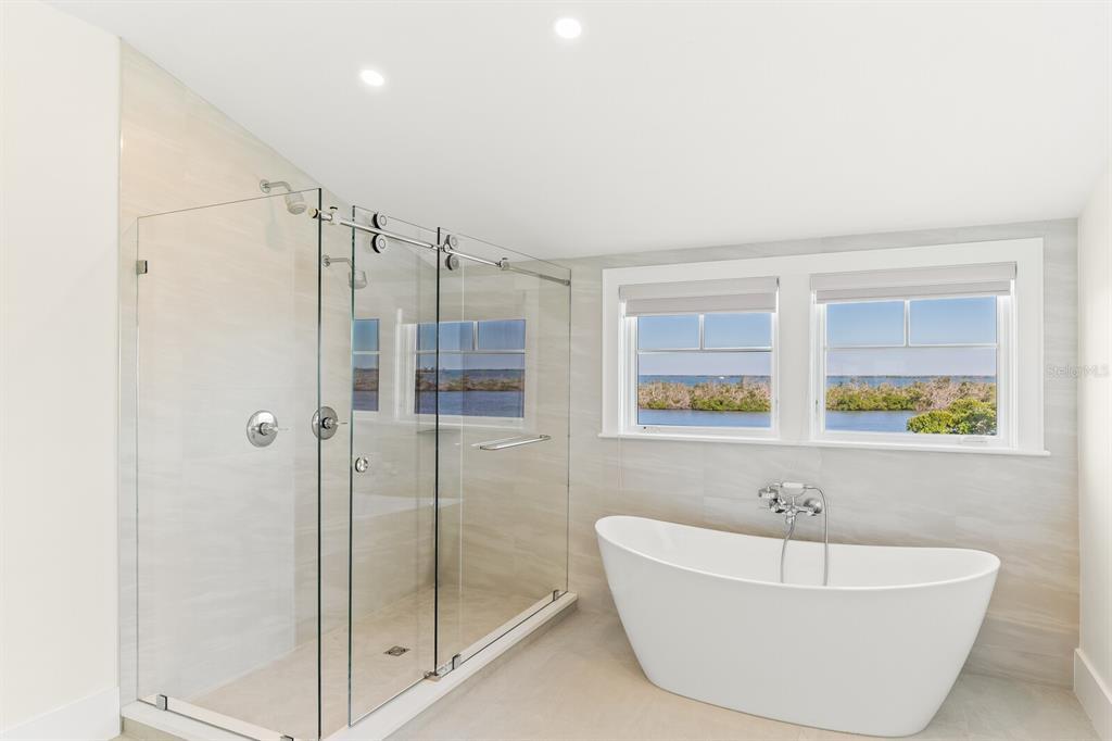 4070 Loomis Avenue Boca Grande, FL 33921 - Photo 33 of 59 a bathroom with a bathtub and a shower