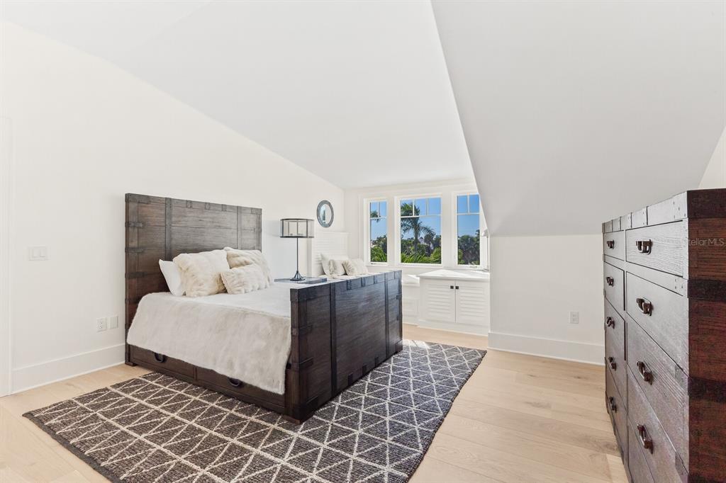 4070 Loomis Avenue Boca Grande, FL 33921 - Photo 35 of 59 a large white bedroom with a bed and a window