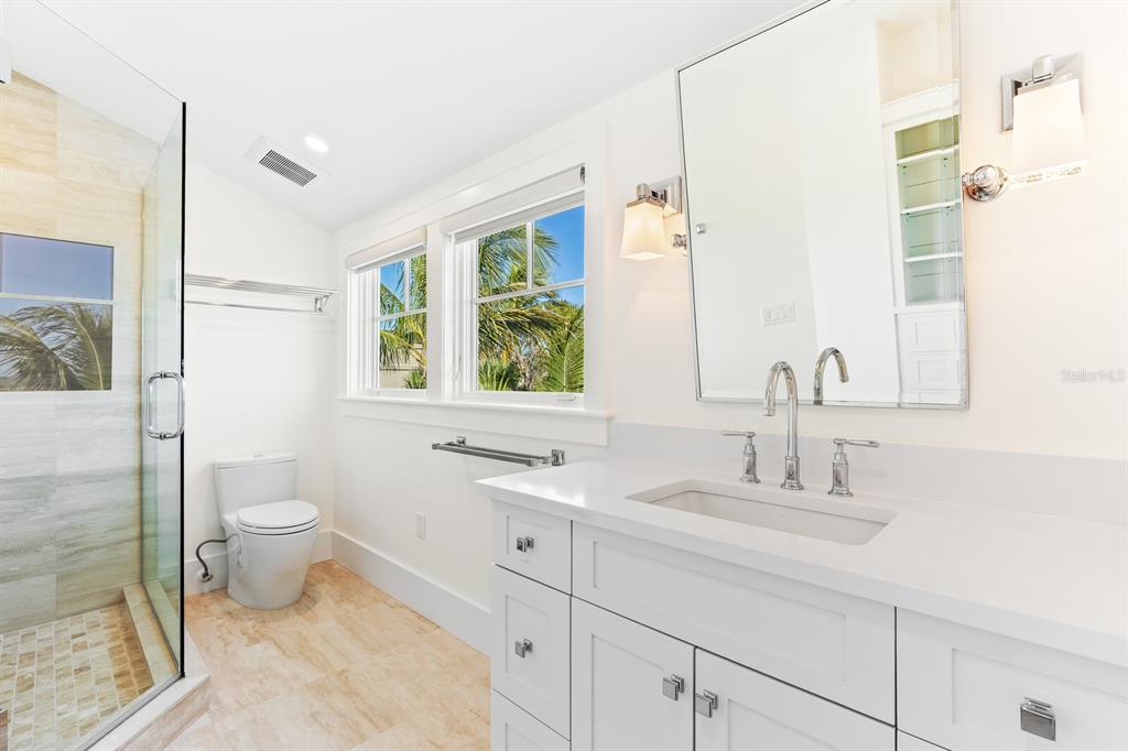 4070 Loomis Avenue Boca Grande, FL 33921 - Photo 39 of 59 a bathroom with a toilet sink and mirror