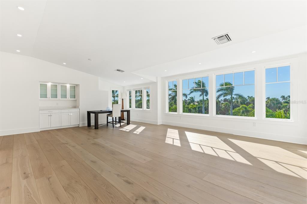 4070 Loomis Avenue Boca Grande, FL 33921 - Photo 40 of 59 a view of an empty room with wooden floor and a window