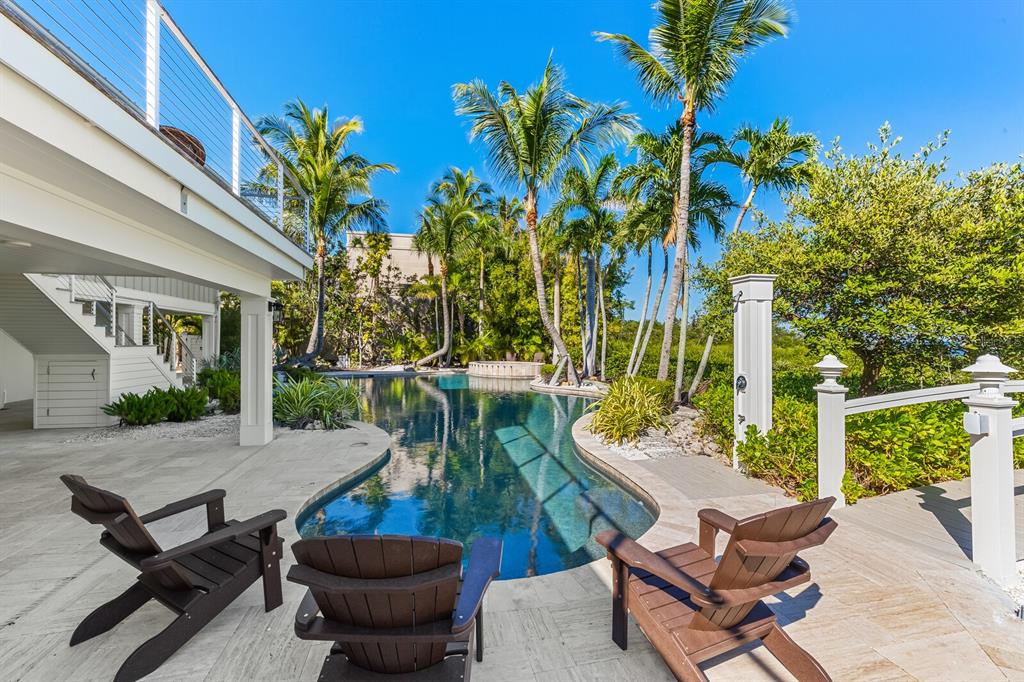 4070 Loomis Avenue Boca Grande, FL 33921 - Photo 45 of 59 a view of a chairs and table in backyard of the house